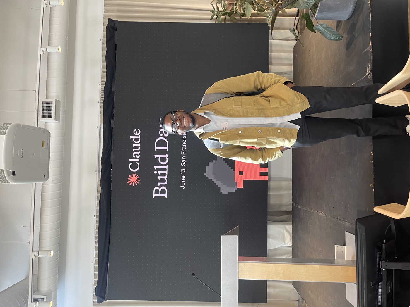 Manuel on stage in front of the Claude Build Day screen, June 13, San Francisco